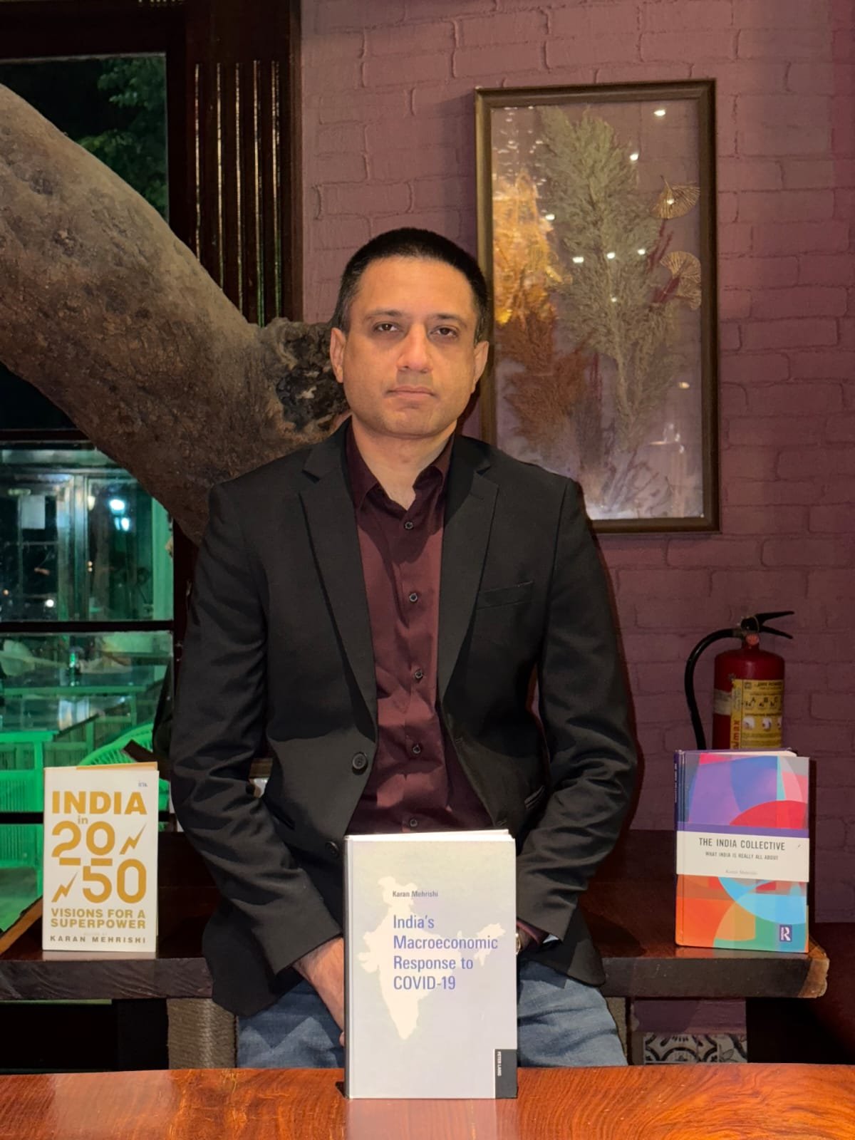 Karan Mehrishi with his books